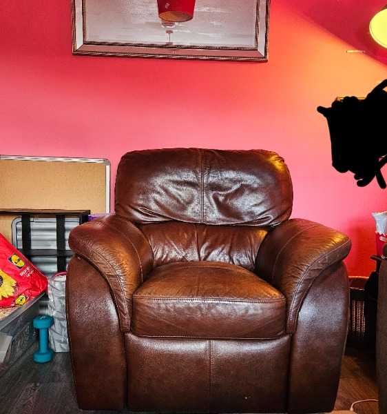 Brown leather manual recliner armchair