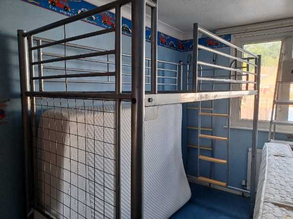 Elevated metal bed frame