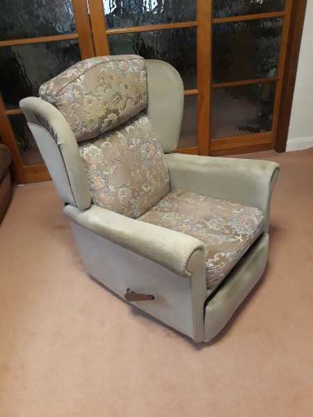 Two matching manual recliner chairs