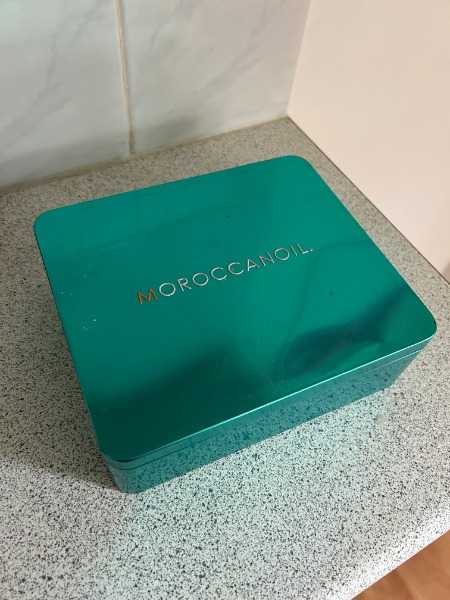 Assortment of hair accessories in a tin
